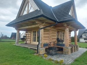 a log cabin with a gambrel roof at Domek Góralski na Gubałówce in Zakopane