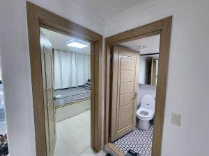 a bathroom with a toilet in a room at Stay JAYU in Daejeon