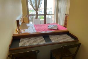 a room with a table with two chairs and a window at TatyHouse in Rome