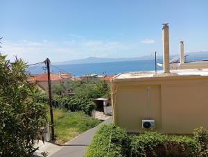 a view of the ocean from a house at kokona apartment in Verga Kalamata