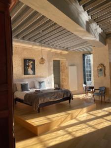 a bedroom with a large bed in a room at Chambre Isabeau de Sully au château de Meauce in Saincaize-Meauce