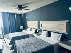 Postel nebo postele na pokoji v ubytování Hotel Union Guadalajara + 8 fotografií