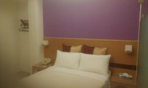 Voodi või voodid majutusasutuse 紫園旅社Purple Garden Hotel toas