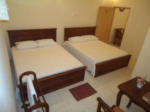 Postel nebo postele na pokoji v ubytování Guest House