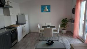 Kuchyň nebo kuchyňský kout v ubytování Apartment Inter Vivos