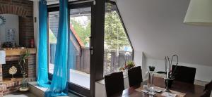 a room with a large window with blue curtains at Sehr schöne, große und zentral gelegene Wohnung in Ahlen
