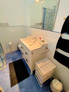a bathroom with a sink and a mirror at Villa dell'Ancora in Capoliveri
