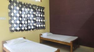 Postel nebo postele na pokoji v ubytování In boys hostel