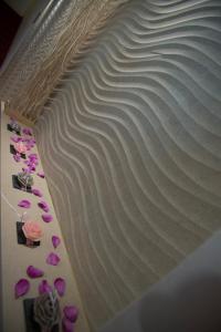 a cake with a wave pattern on top of it at Hotel Okinawa in Rimini