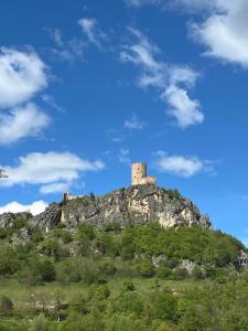 a hill with a castle on top of it at Apartman Iman in Bihać +12 photos