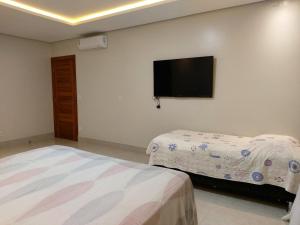 Giường trong phòng chung tại Quarto Àvila