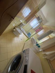 an overhead view of a laundry room with a washing machine at Elenis home in Vlorë