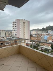 a balcony with a view of a city at Elenis home in Vlorë