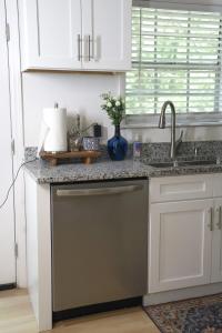 a kitchen with a sink and a dishwasher at 3 Bedroom Lake House With Garage in Tallahassee