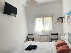 TV a/nebo společenská místnost v ubytování Pensión El Pozo + 37 fotografií