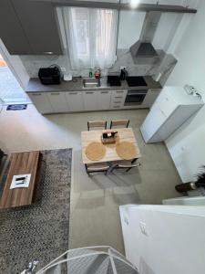 an overhead view of a kitchen with a table at Maravel house in Heraklio Town +25 photos