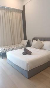 En eller flere senge i et værelse på Star Residence Klcc By Stellar Inn