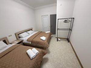 Ένα ή περισσότερα κρεβάτια σε δωμάτιο στο Guest House MD