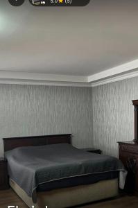 a bedroom with a bed in a room at Eka's house in Goristsikhe in Itʼkhvisi