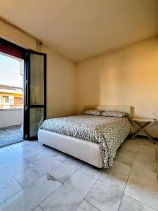 Un pat sau paturi într-o cameră la Casa al Forte - Versilia - Beach and Free Parking