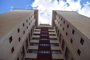 two tall buildings looking up at the sky at Residence Next Door Gz in Kiambu