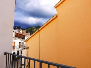 a view from a balcony of an orange building at La casita verde in Cazorla