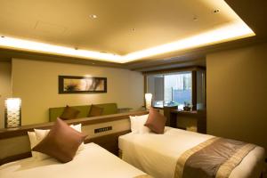Llit o llits en una habitació de Hotel Keihan Kyoto Grande