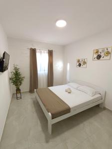 Postel nebo postele na pokoji v ubytování Apartmani Vuki + 18 fotografií