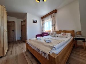 Postel nebo postele na pokoji v ubytování Pokoje Gościnne Wierzbówka przy Termach