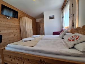 Postel nebo postele na pokoji v ubytování Pokoje Gościnne Wierzbówka przy Termach