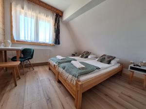 Postel nebo postele na pokoji v ubytování Pokoje Gościnne Wierzbówka przy Termach