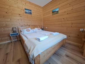Postel nebo postele na pokoji v ubytování Pokoje Gościnne Wierzbówka przy Termach