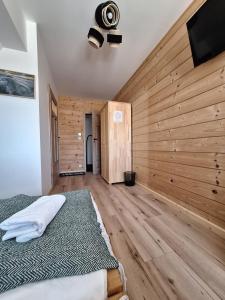 Postel nebo postele na pokoji v ubytování Pokoje Gościnne Wierzbówka przy Termach