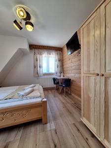 Postel nebo postele na pokoji v ubytování Pokoje Gościnne Wierzbówka przy Termach