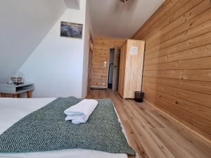 Postel nebo postele na pokoji v ubytování Pokoje Gościnne Wierzbówka przy Termach