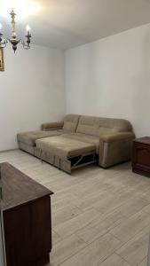 a living room with a large bed in a room at Квартира одна-комнатная in Yerevan