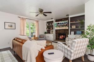 a living room with a couch and a fireplace at Trailside Country Haven in Bagdad