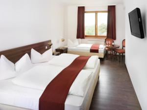 Krevet ili kreveti u jedinici u objektu Hotel Marc Aurel
