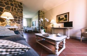 a living room with a couch and a table at Il Principino Country Resort in Vinci