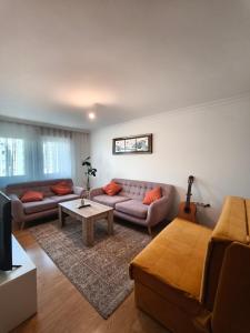 Posezení v ubytování Prishtina Urban Apartment + 3 fotografie