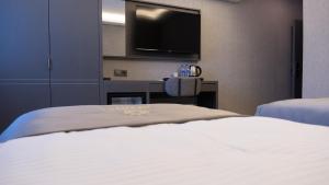 Postel nebo postele na pokoji v ubytování Optimal Hotel