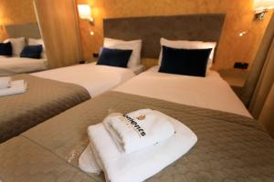 Łóżko lub łóżka w pokoju w obiekcie Hotel Elements