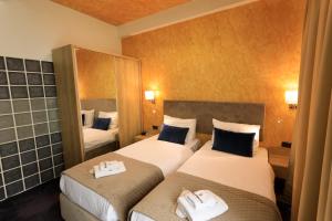 Łóżko lub łóżka w pokoju w obiekcie Hotel Elements