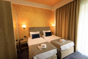 Łóżko lub łóżka w pokoju w obiekcie Hotel Elements