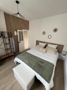 En eller flere senge i et værelse på La P'tite Maison D'Auron