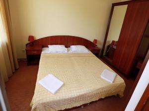 
Кровать или кровати в номере Гостиница «Ак-гёль»
