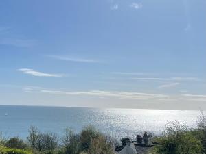 a view of the ocean from a house at Loughview Lodge in Whitehead