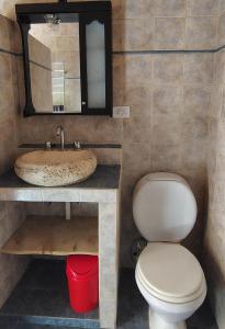 a bathroom with a toilet and a sink at La Casa Azul in San Javier +12 photos