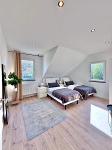 Postel nebo postele na pokoji v ubytování TOP! Neu saniertes Apartment "Anton", direkt am Ruhrtalradweg in Arnsberg - Neheim