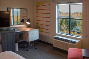 Postel nebo postele na pokoji v ubytování Snoqualmie Inn by Hotel America